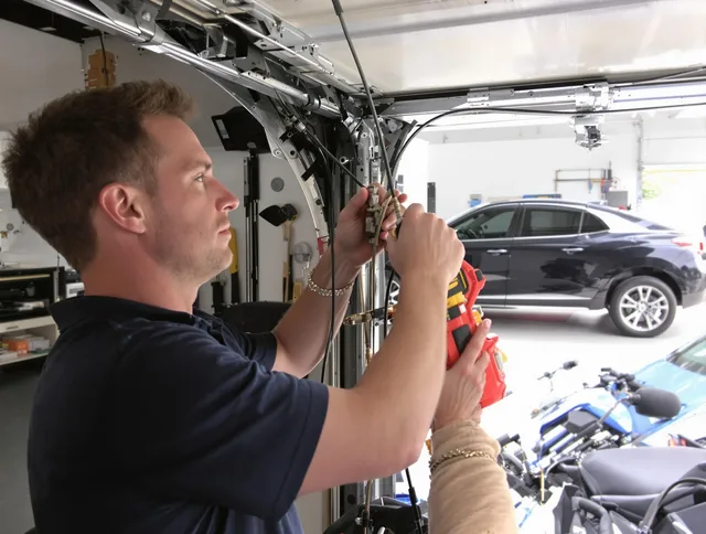 Kannapolis Garage Door Repair safety certified technician performing cable replacement in Kannapolis
