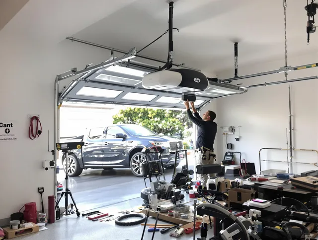 Kannapolis Garage Door Repair specialist installing smart garage door opener system in Kannapolis home
