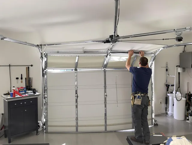 Kannapolis Garage Door Repair specialist performing precise section replacement on Kannapolis garage door